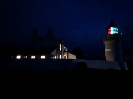 Lighthouse and Lodge by night