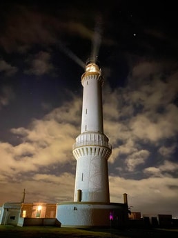 The lighthouse at night.